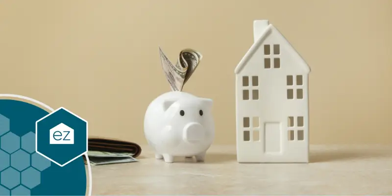 piggy savings bank and wallet beside a tiny home model