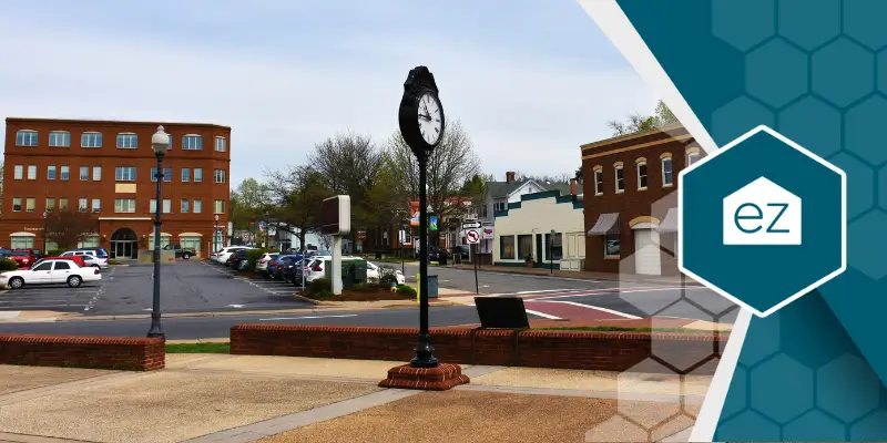 an empty street with a public clock in Manassas VA