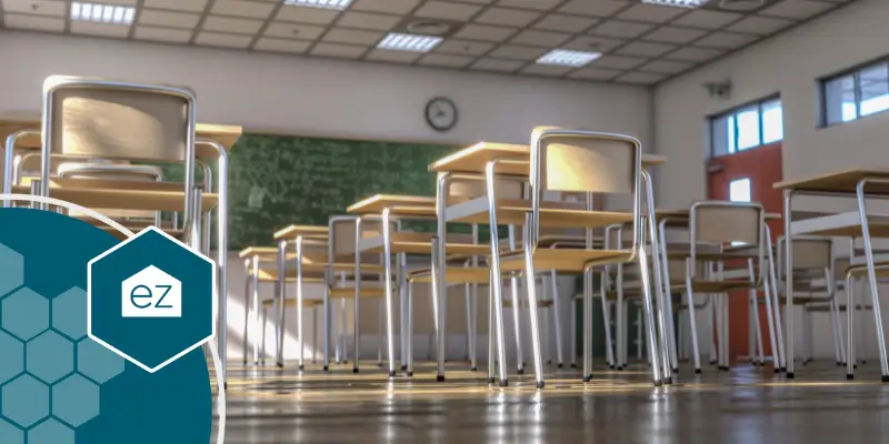 tables and chairs in an empty classroom