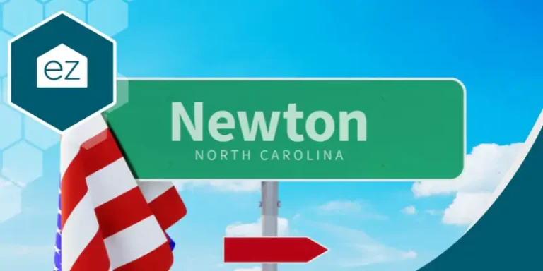 a signage saying Newton North Carolina with a folded US flag