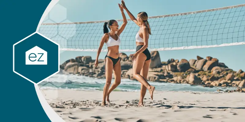 women playing beach volley ball