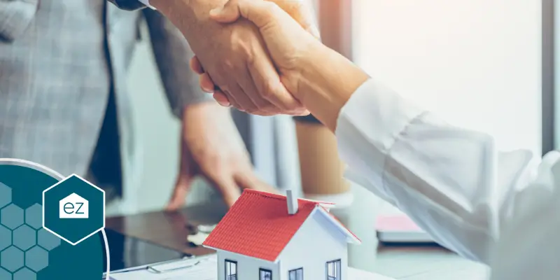 handshake with a real estate broker with a home buyer