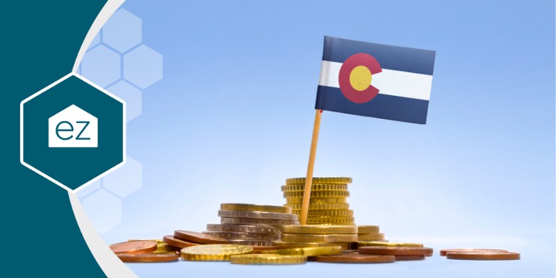 Colorado flag in between coins