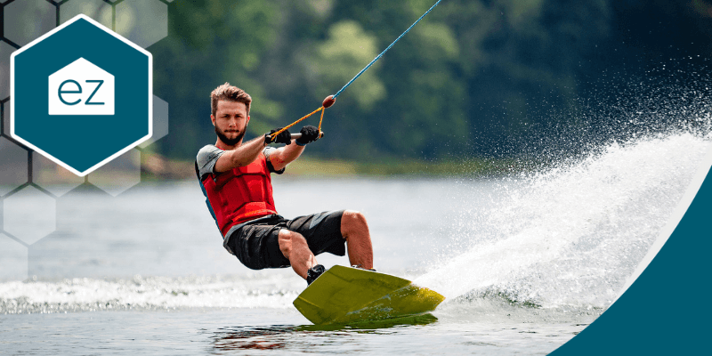 A man enjoys wakeboarding activities in the lake