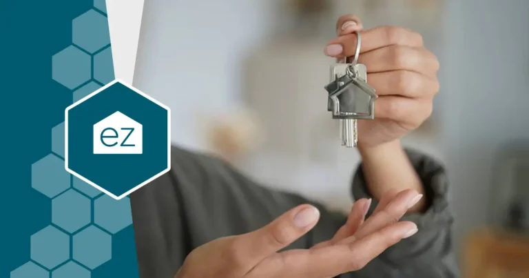 a real estate agent holding a key for a newly rented home