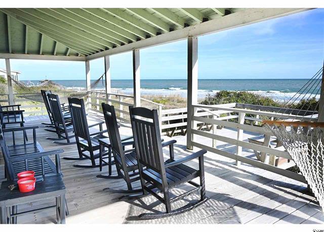 Back porch with rocking chairs oceanfront in Pawleys Island