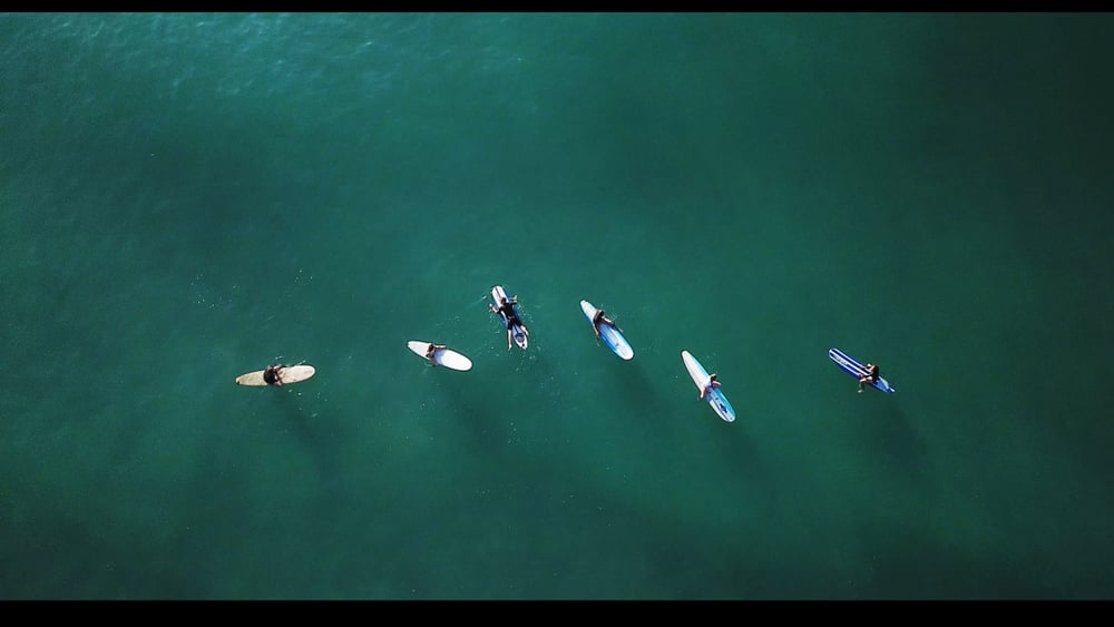 Surfers floating in the Ocean in Carolina Beach