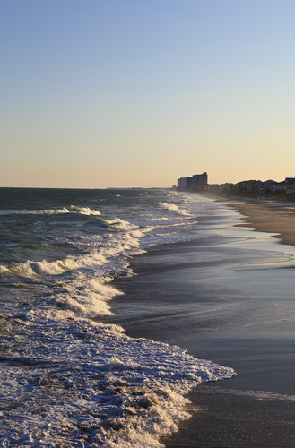 Surfside Beach with water and sand