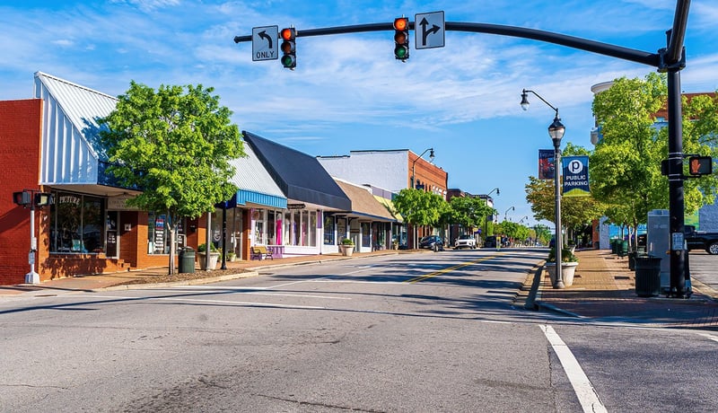 Street view of downtown shops on a sunny day in Faquay Varina, North Carolina
